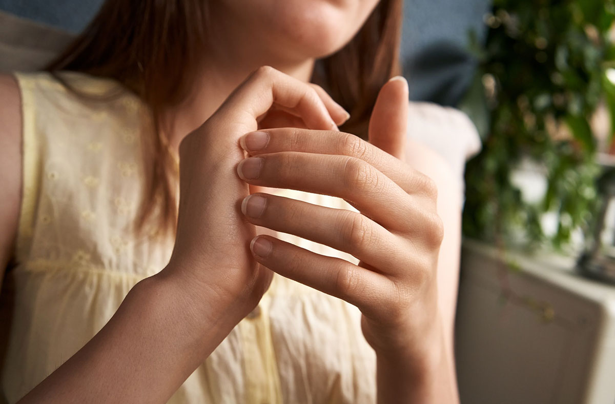 Thought Field Therapy tapping image of woman doing self-tapping therapy.